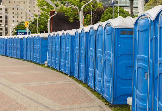 a line of portable restrooms at an outdoor wedding, catering to guests with style and comfort in Bonita Springs, FL